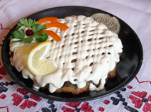 Kolduny, potato pancakes with meat in a pike and mushroom sauce